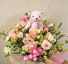 small teddy in flowers